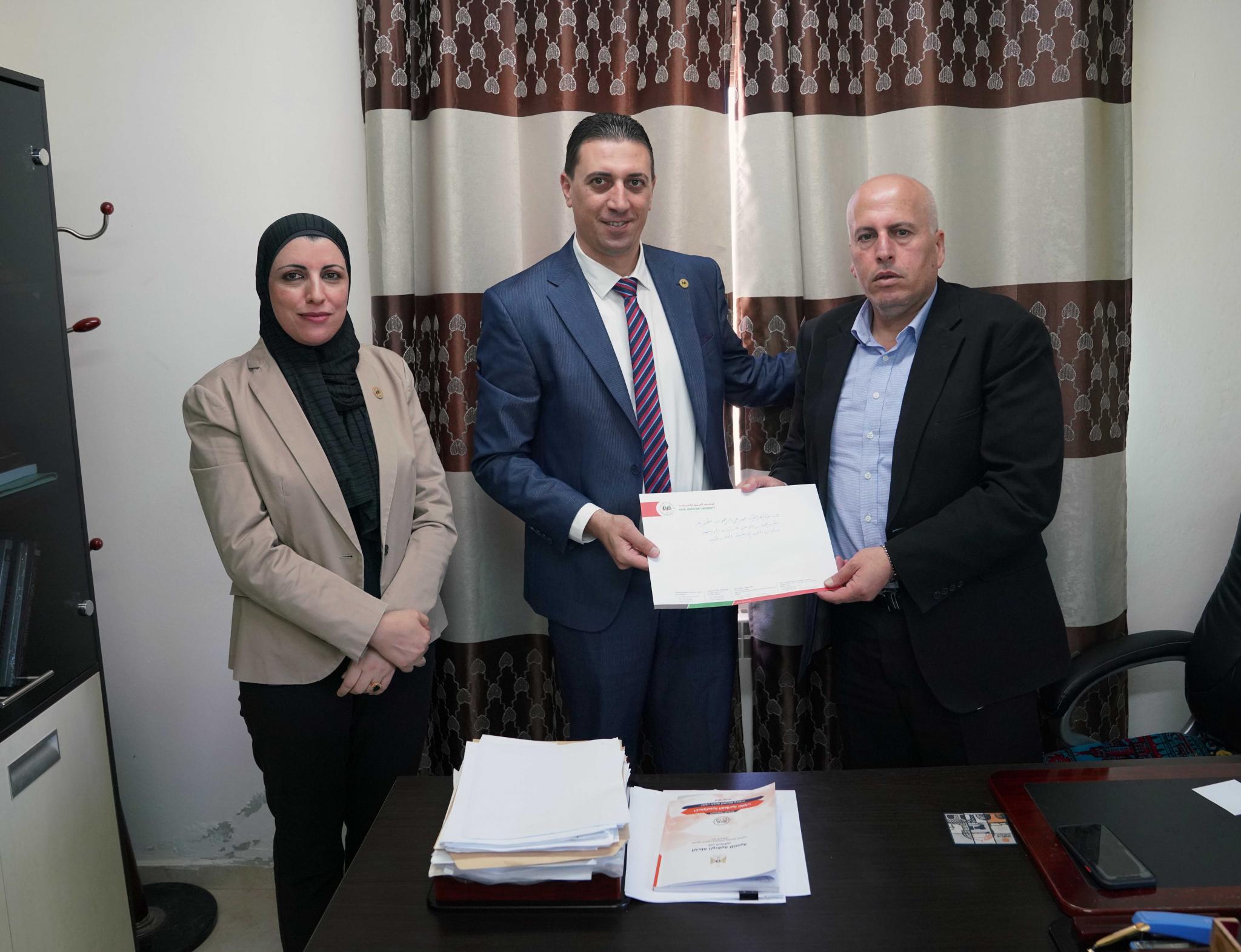 The Public Relations Department in AAUP Hands Master’s Degree Scholarship Notes to Palestinian Organizations