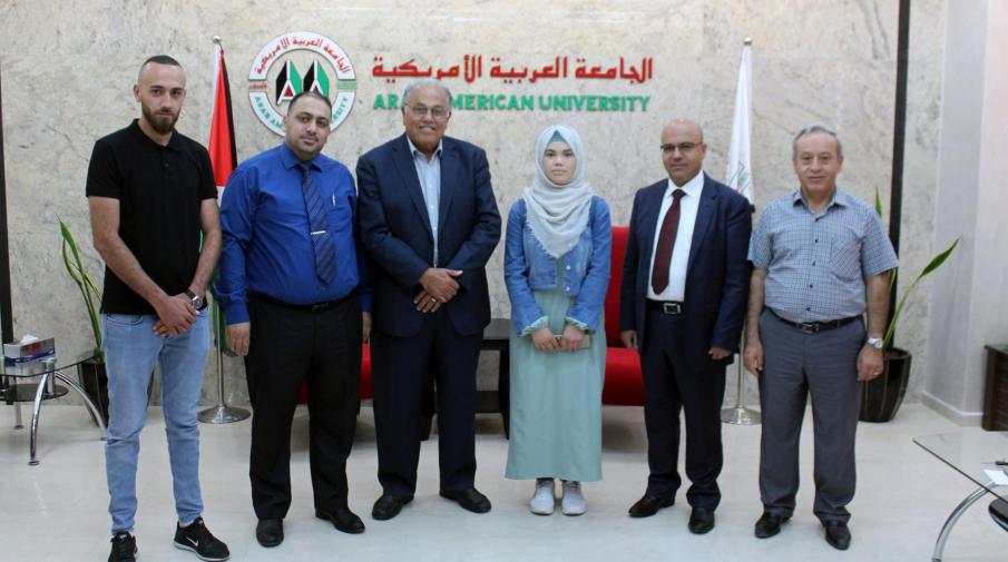 Prof. Dr. Ali Zidan Abu Zuhri offers a full scholarship to the student Buthayna Ghanam, the first at Palestinian level in the literary branch