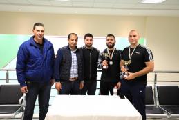 Honoring the winners in the first and second places in the squash championship in AAUP
